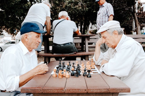 2 old friends playing a game of chess